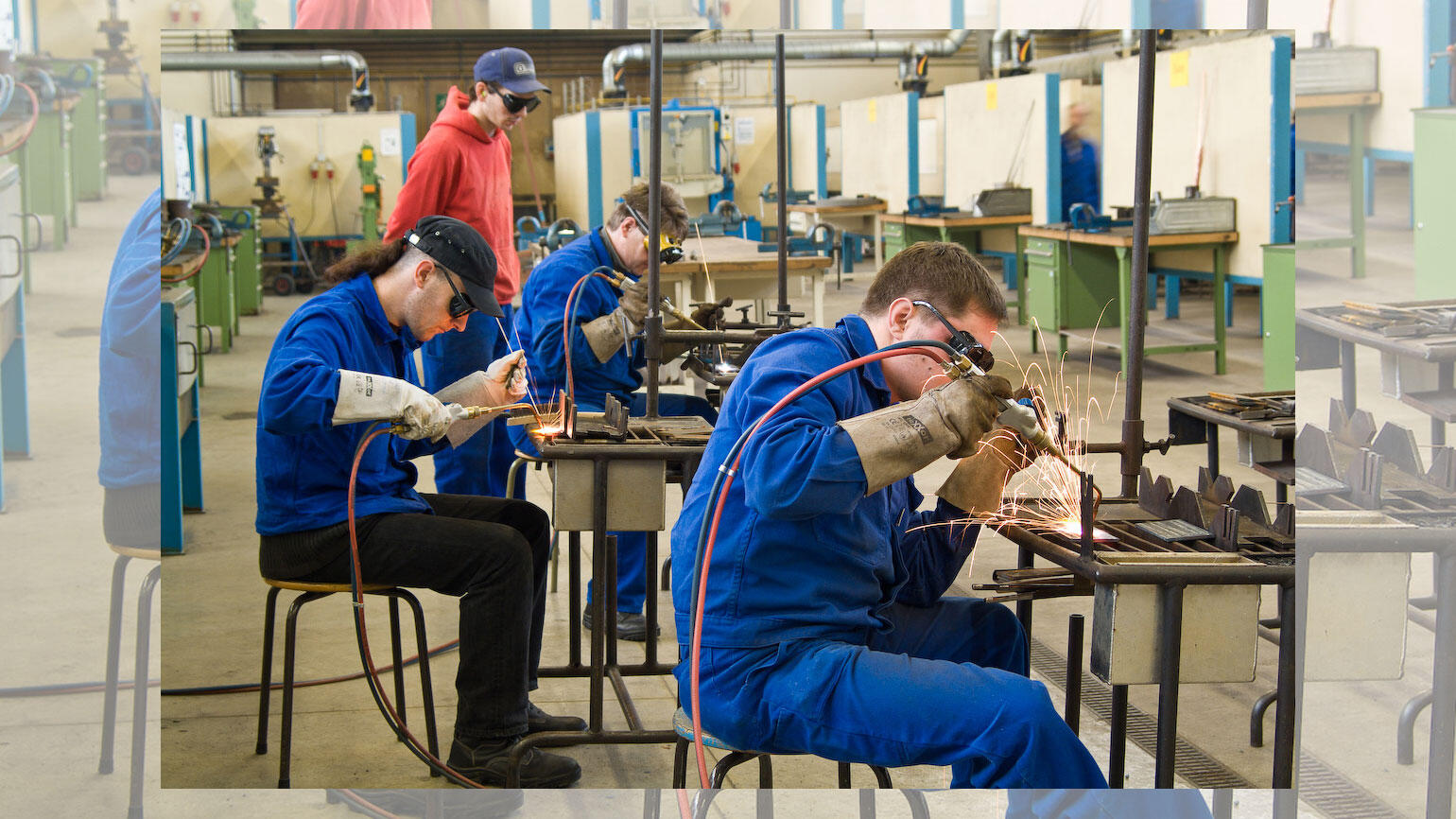 young men from Poland practising welding in a training workshop
