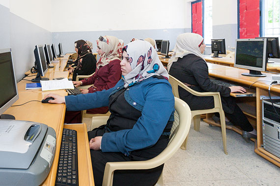 classroom with Arab women working at computers