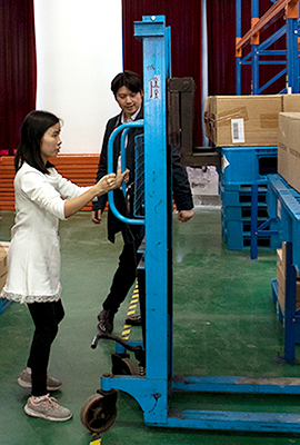 Chinese woman drives a lift truck
