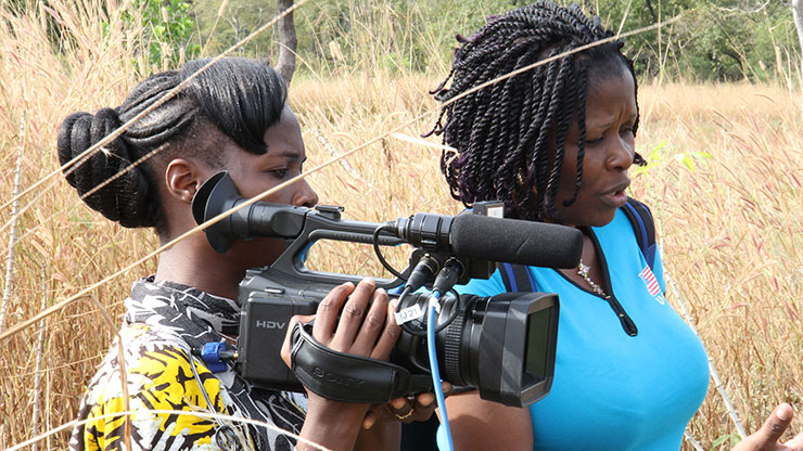 two african women with a television camera