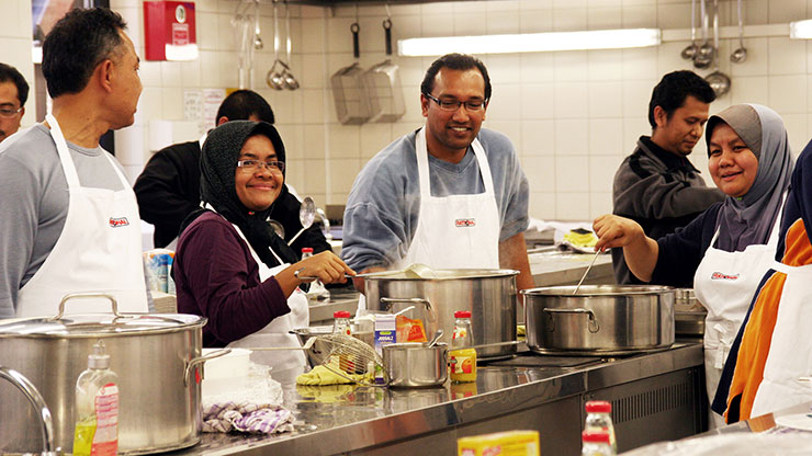 Malaysian trainers cooking together