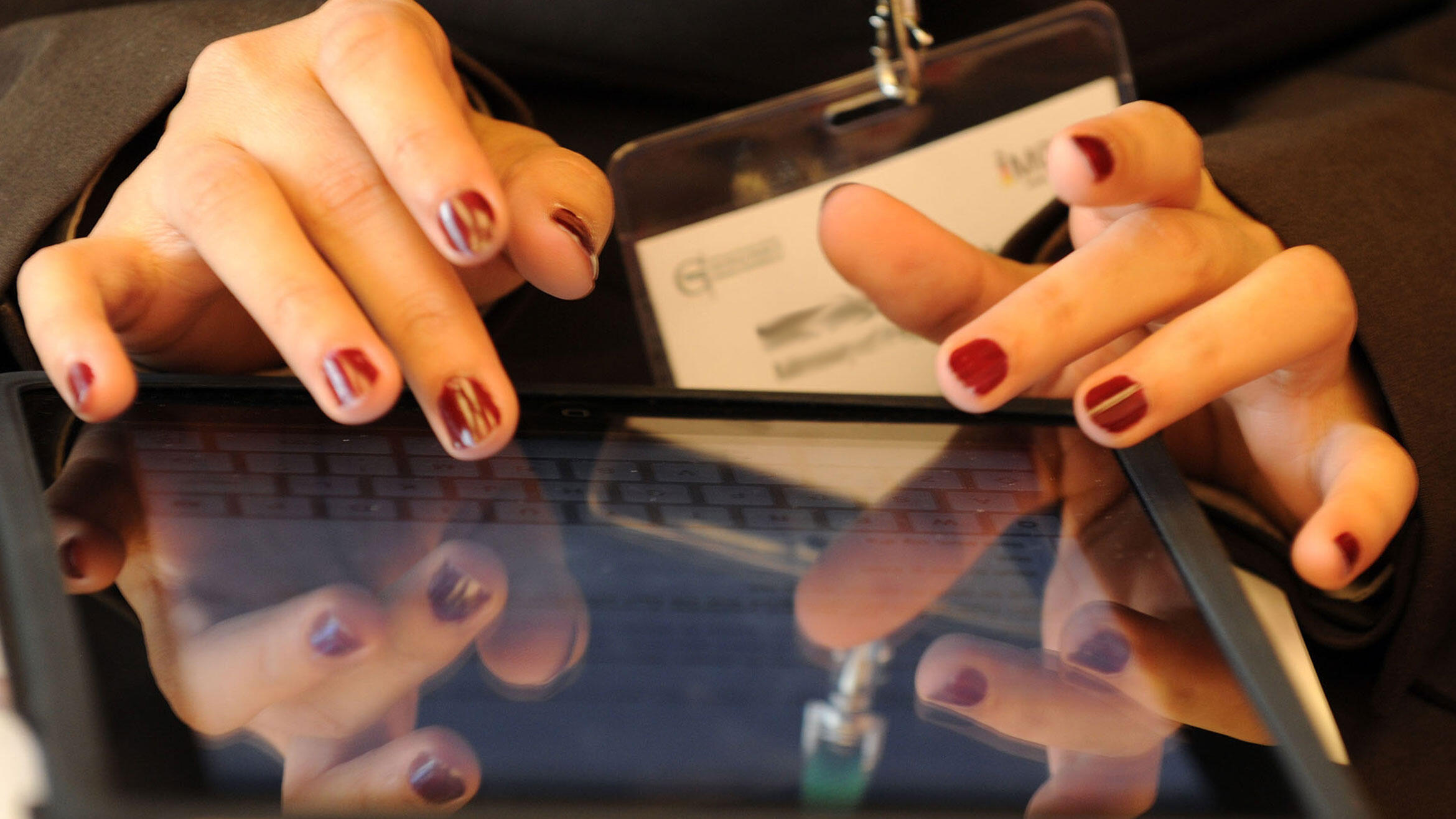 close-up: hand over the display of a portable terminal