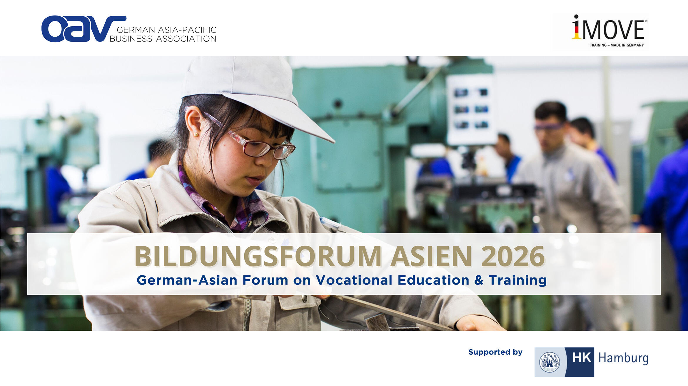 A young Chinese woman in a training workshop files a workpiece that is clamped in a vice.