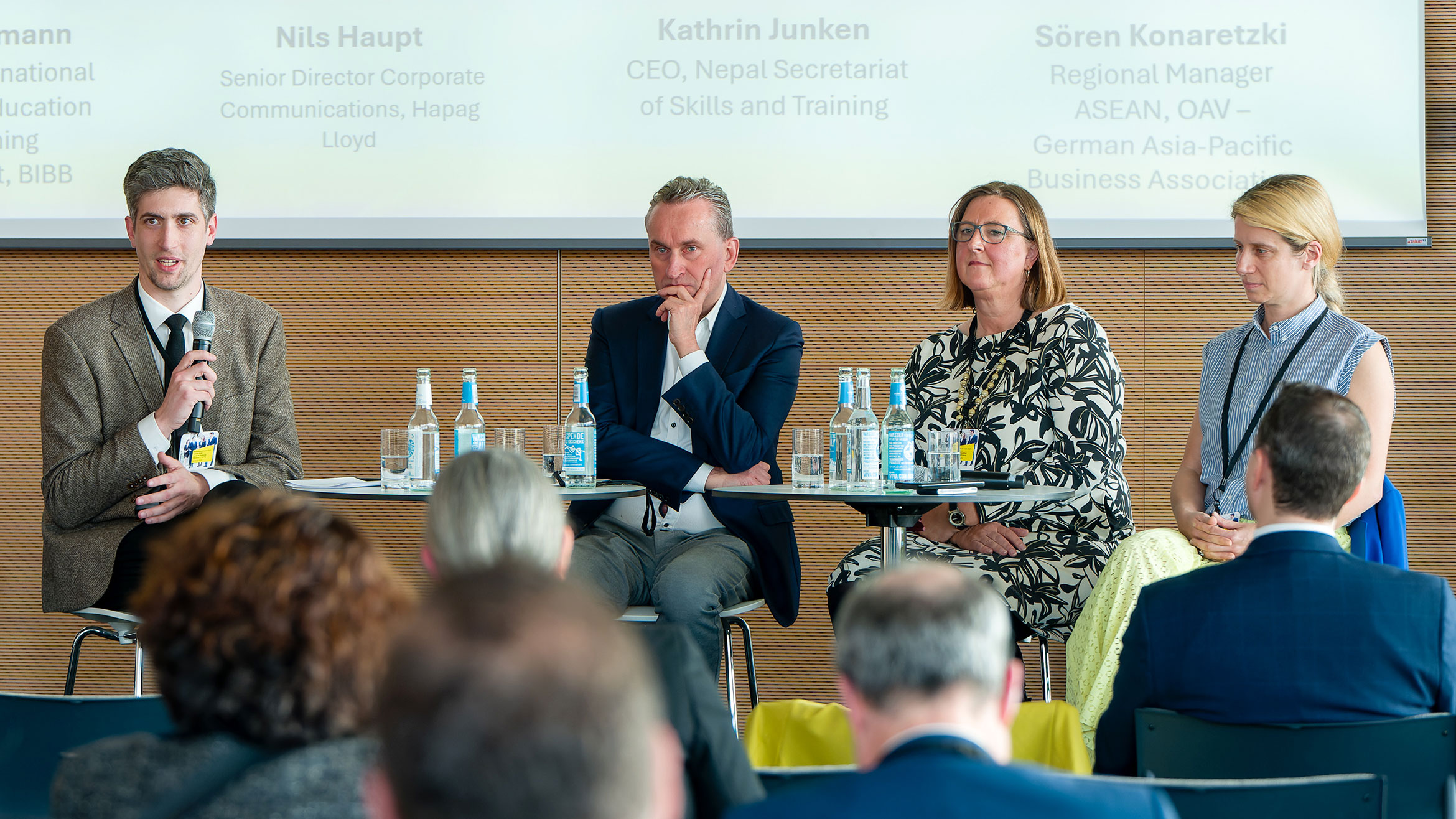 four people sit on the panel