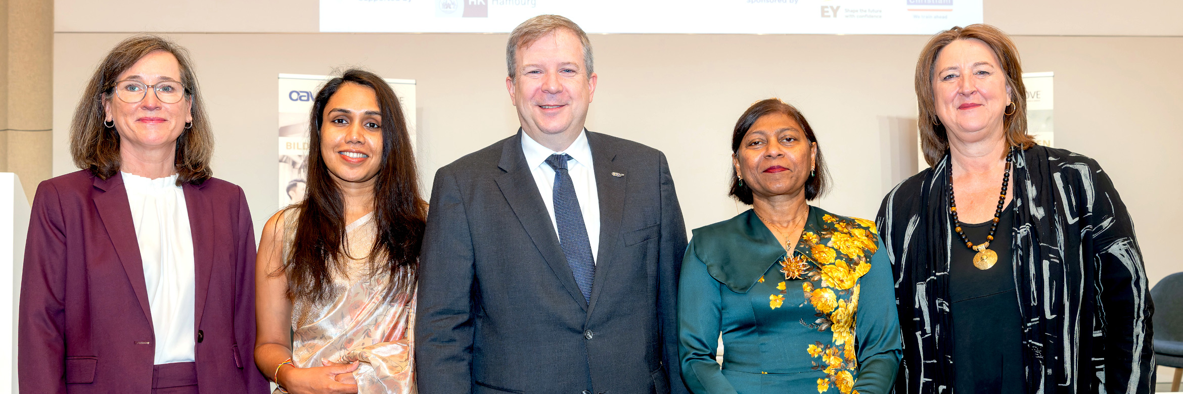Group photo with four women and one man