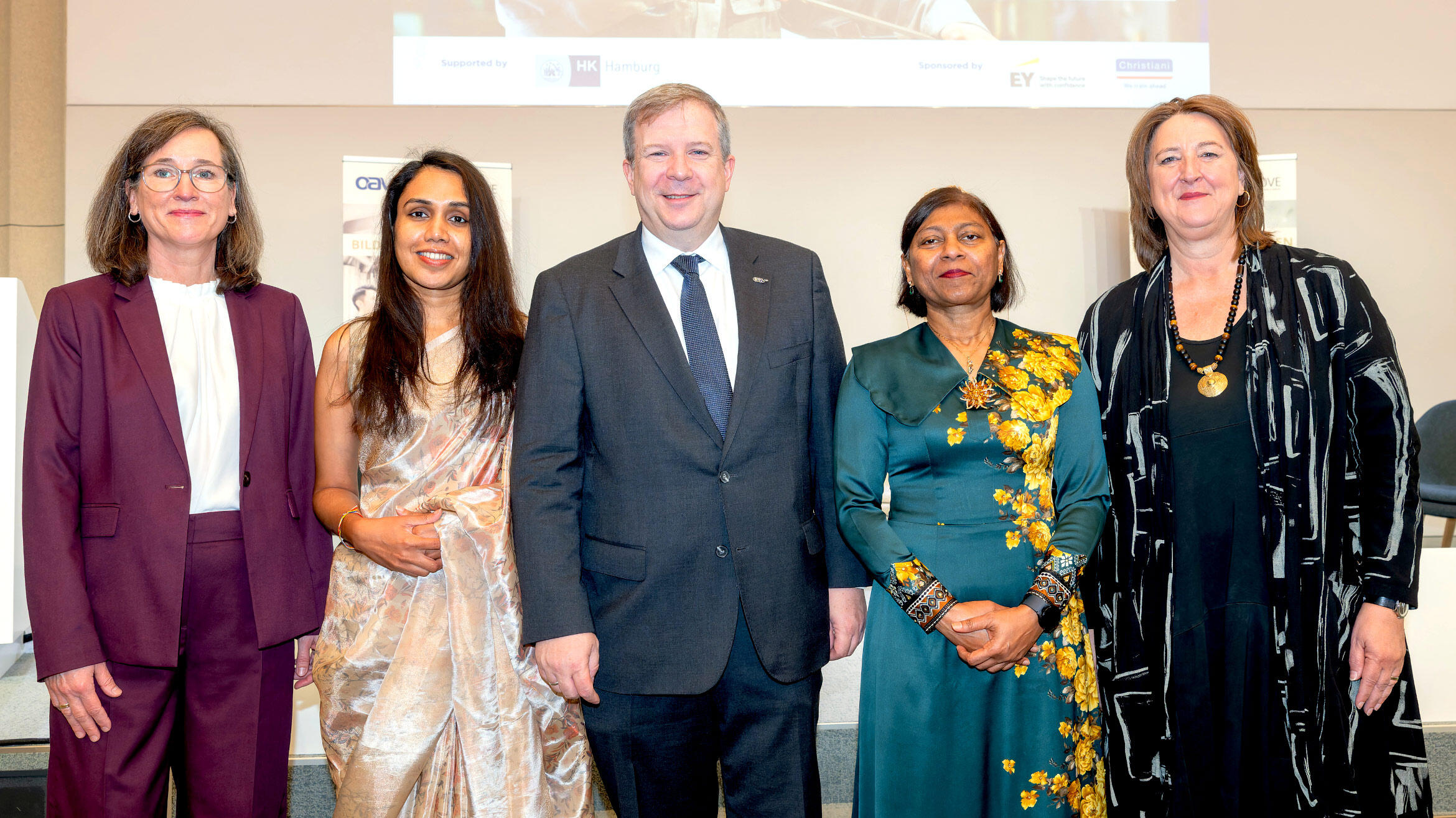 group photo with four women and one man