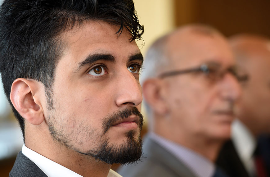 Close-up of a participant listening to a speaker