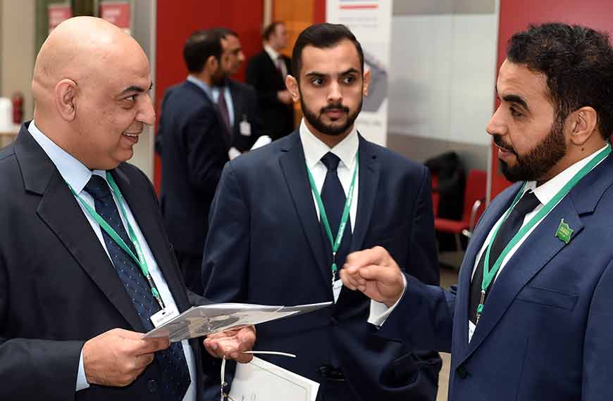 three men in conversation