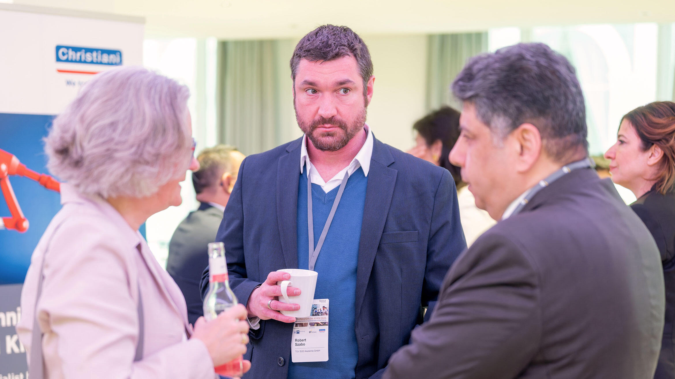 woman and two men in discussion