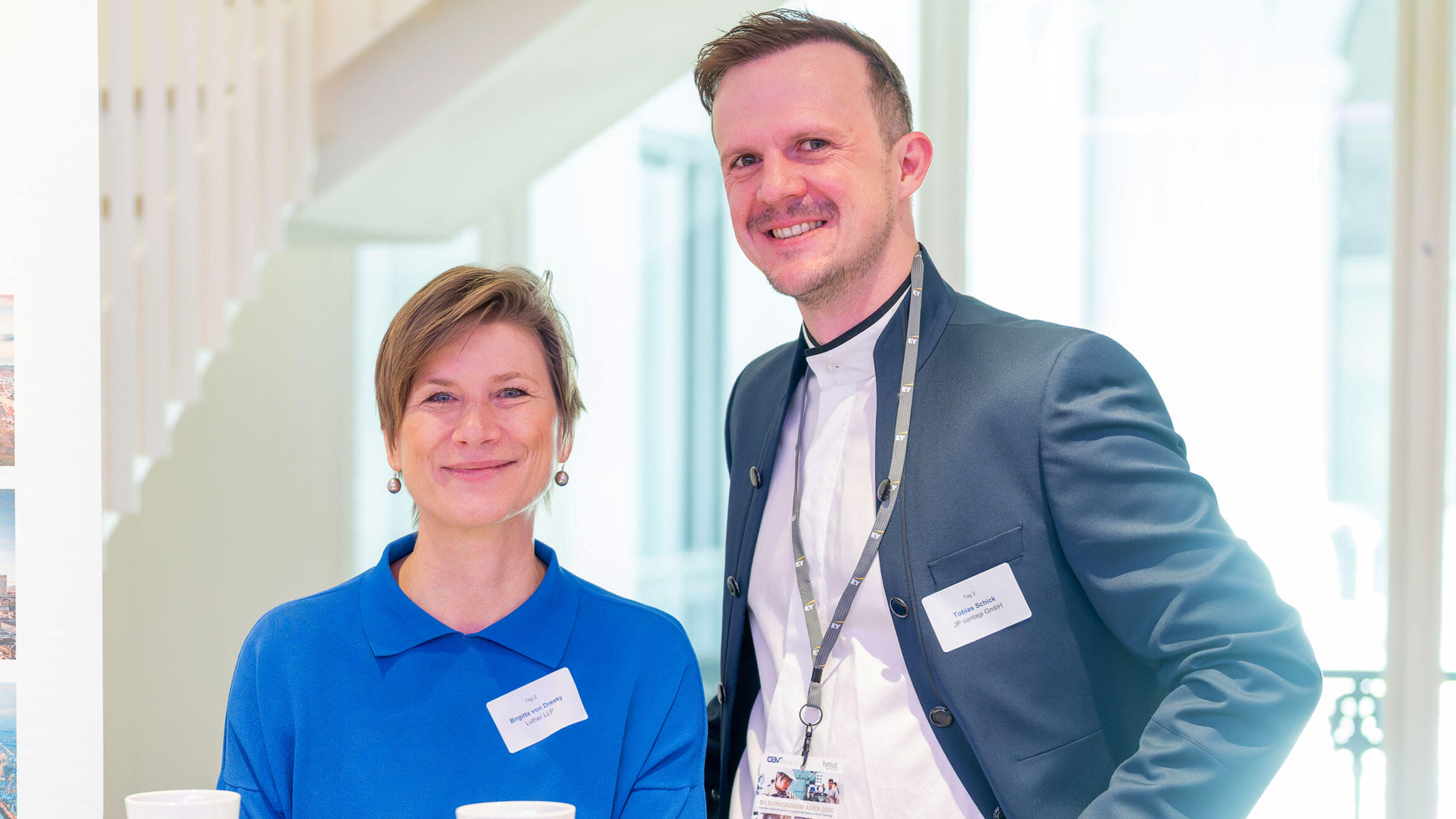 woman and a man are smiling at the camera