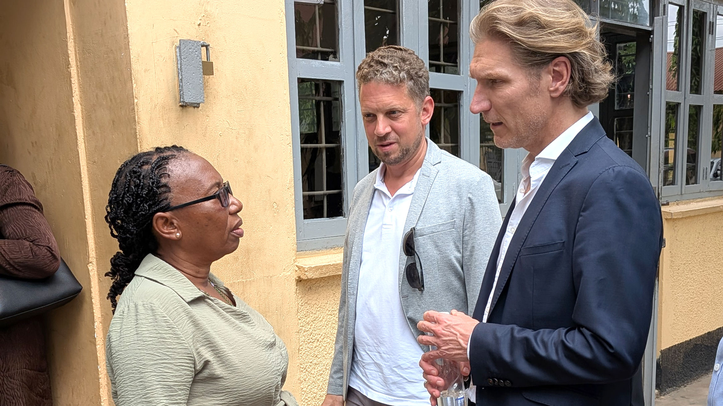 Three people in conversation
