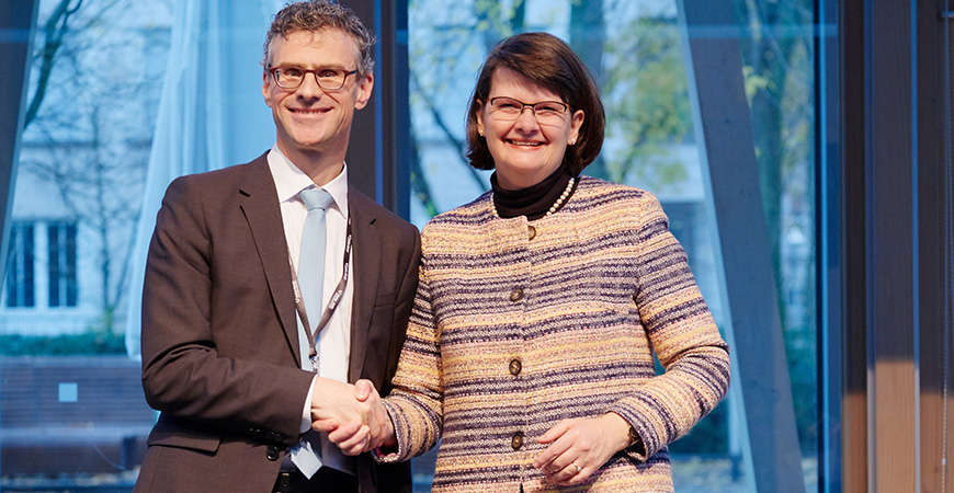 close-up of a woman and a man shaking hands