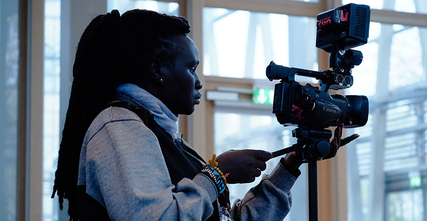 woman with a film camera