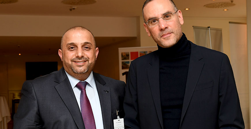 two people smiling into the camera