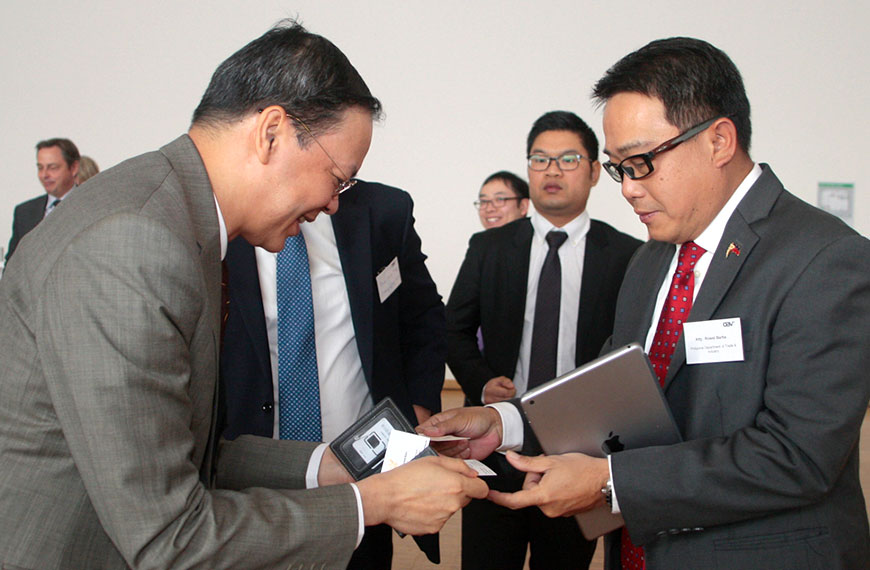 two men exchanging business cards