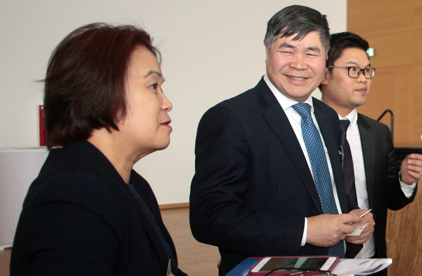 three people in discussion