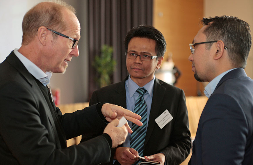 three people in conversation