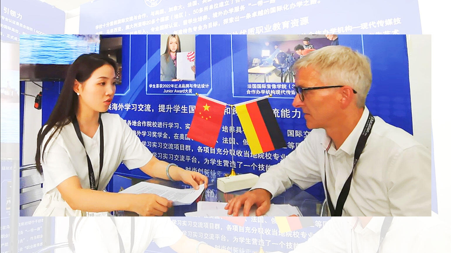 Man and a woman sitting at a table and having a discussion