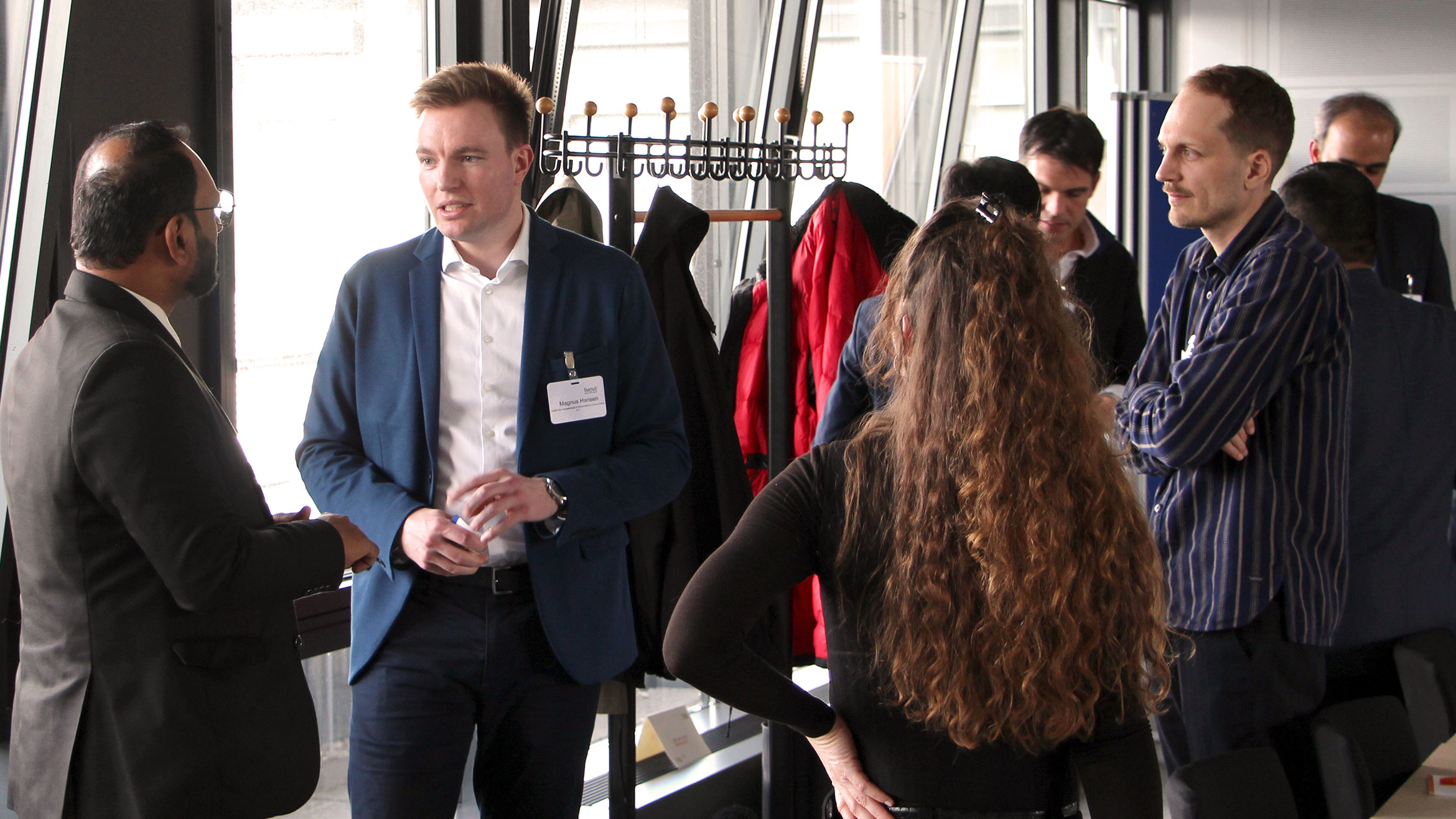 Indian and German participants in small groups in conversation