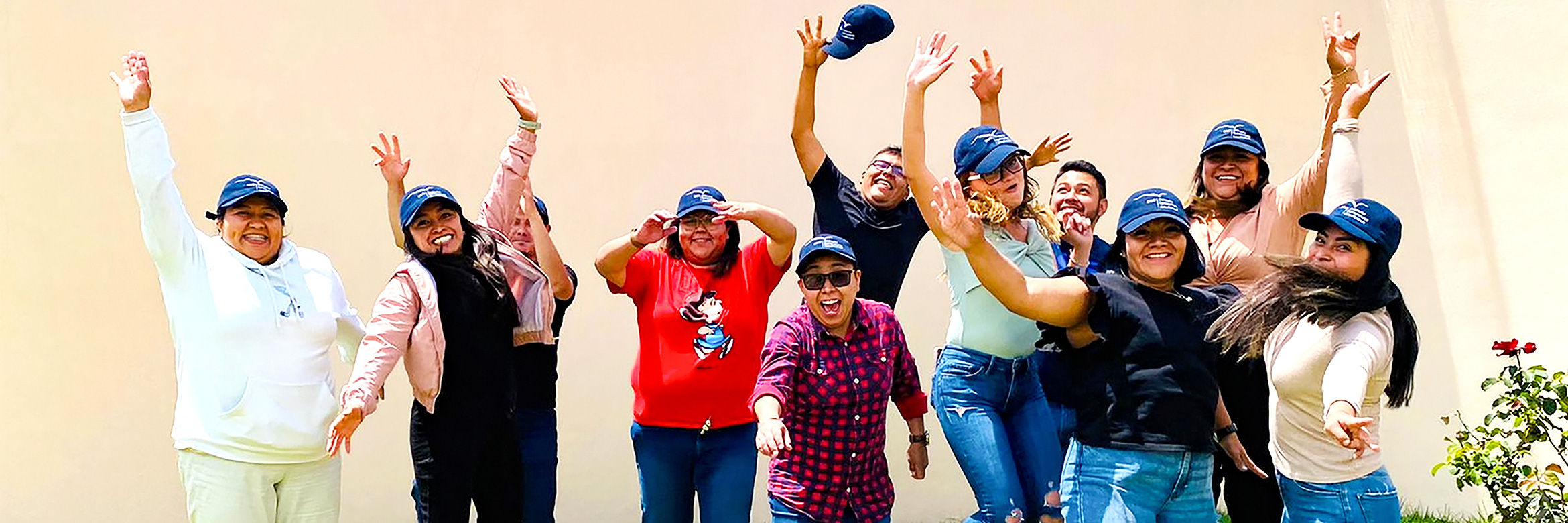 Group of young adult Mexicans jump in the air