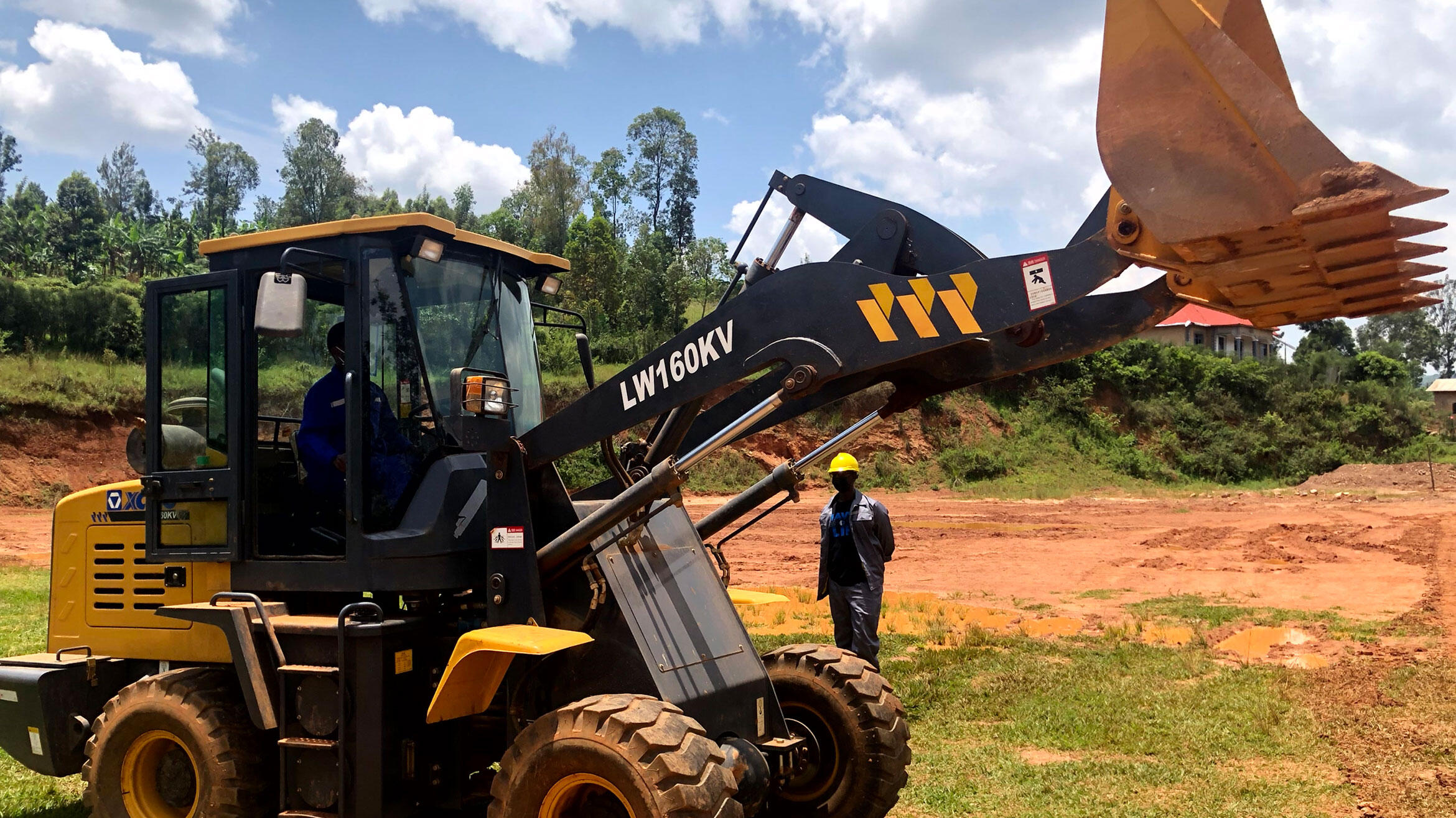 Rwandan drives an excavator