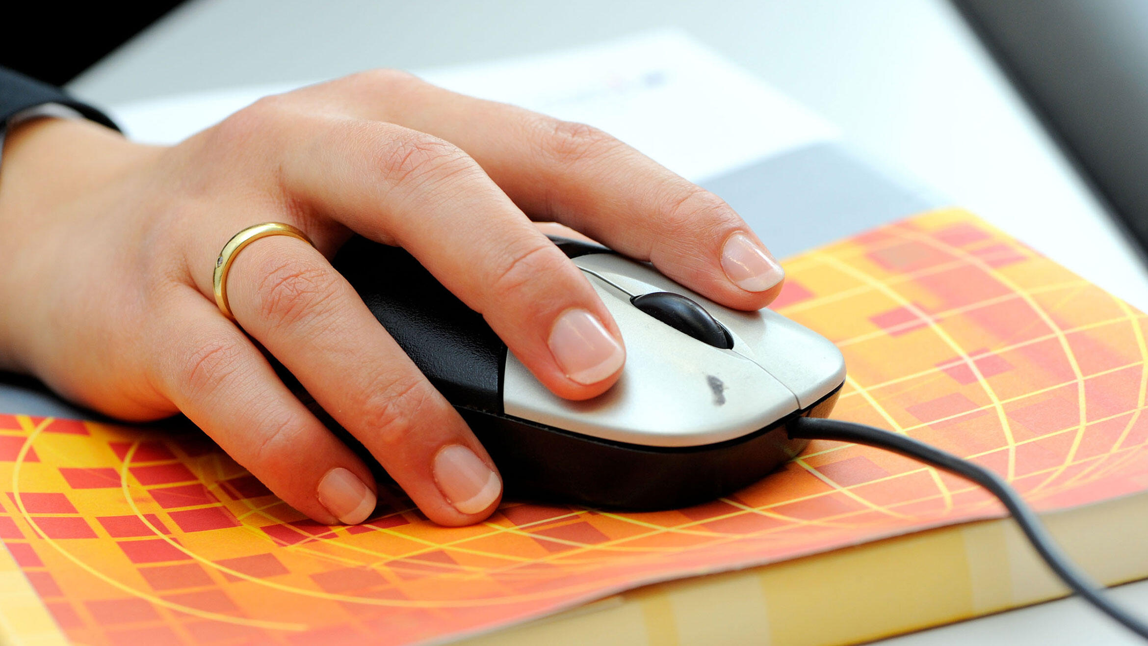 hand on computer mouse