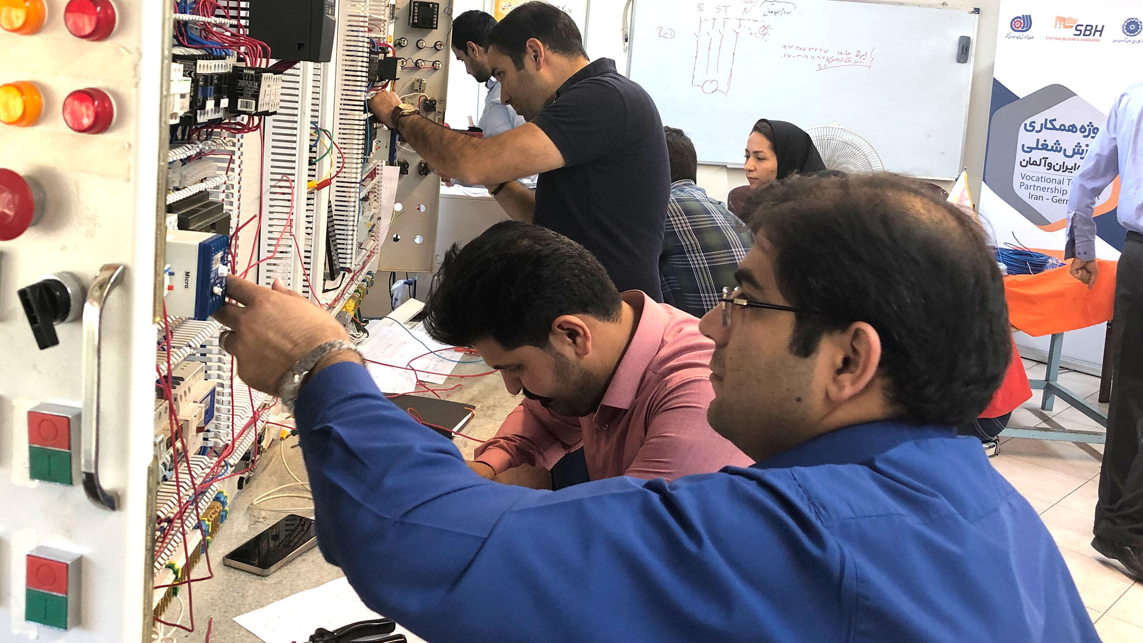 Several persons at one switchboard