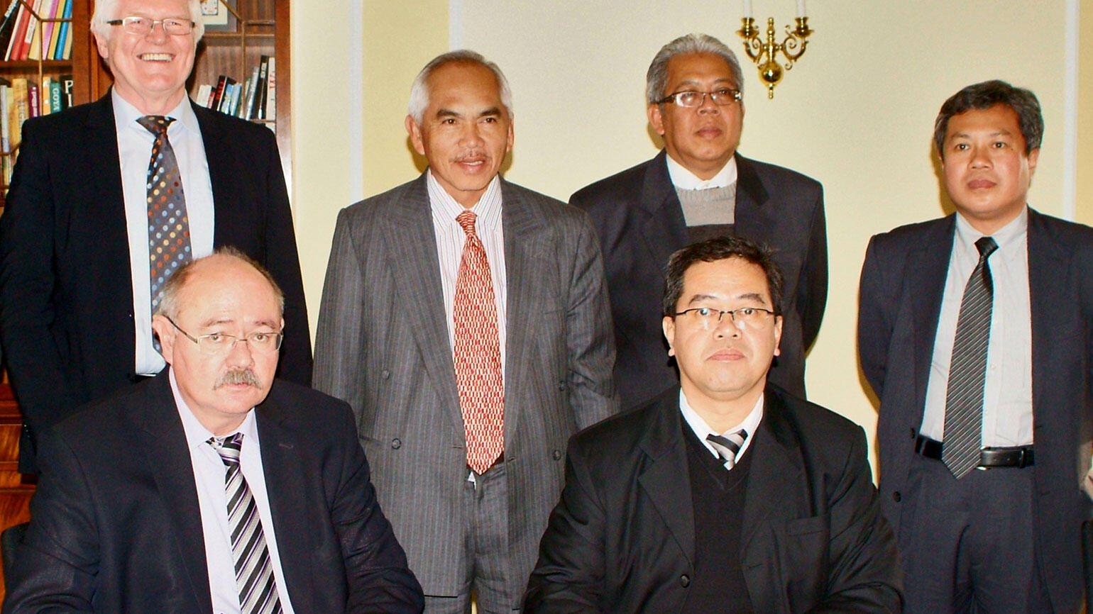 group picture at a signing ceremony