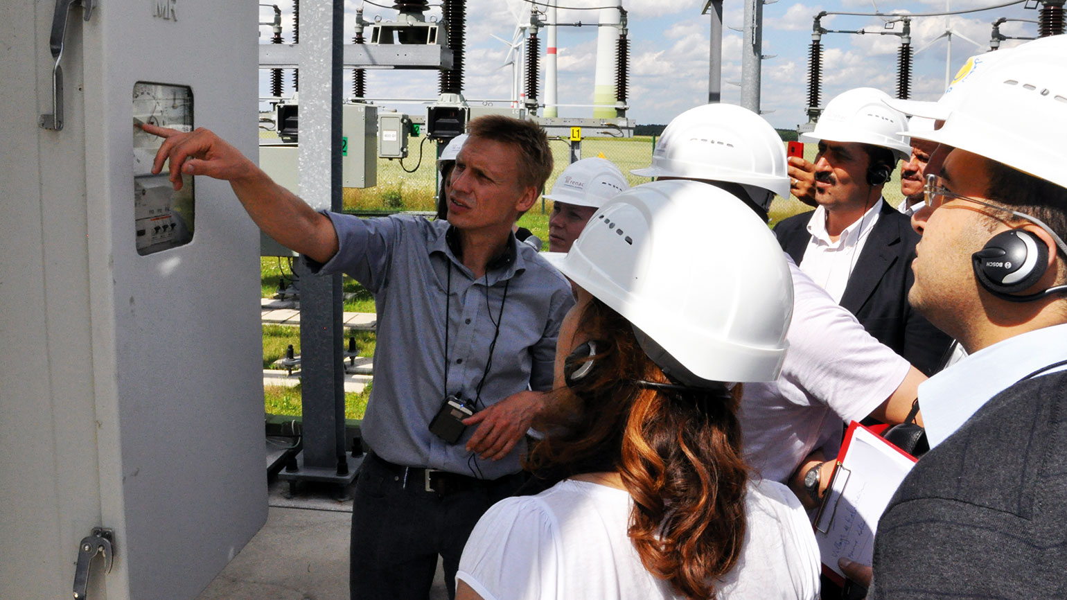 trainer explains something about a control box