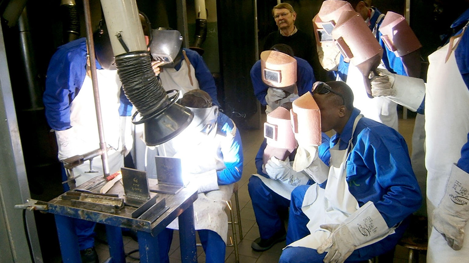 Nigerians learn to weld in a training workshop