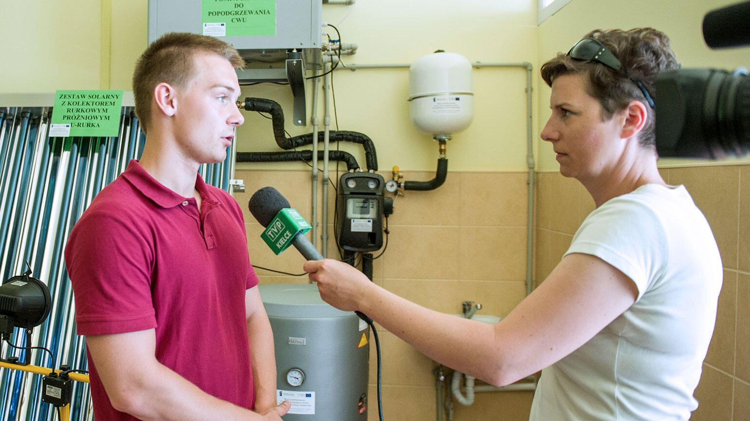 young man from poland gives an interview