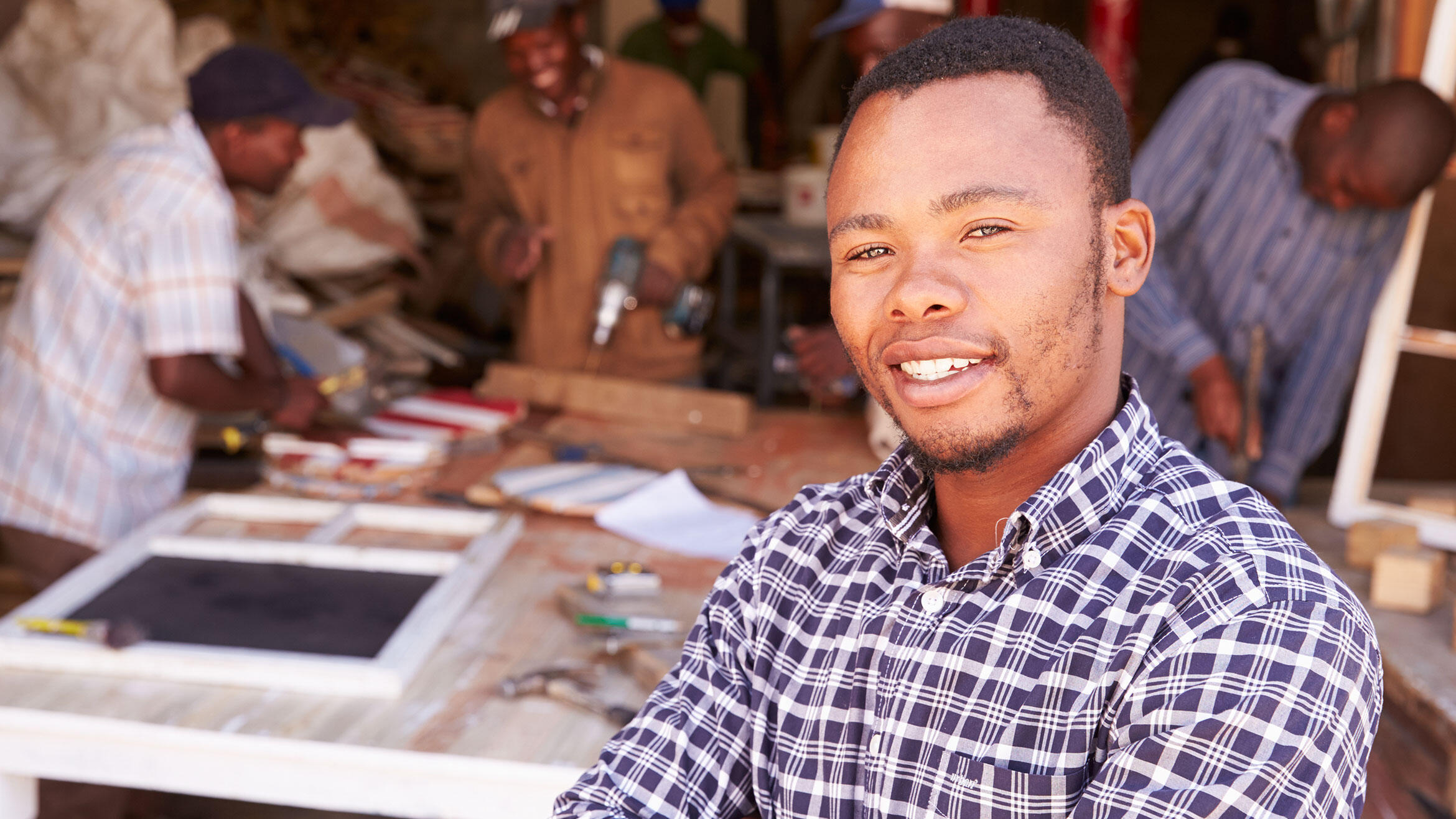 young african man smiling into the camera