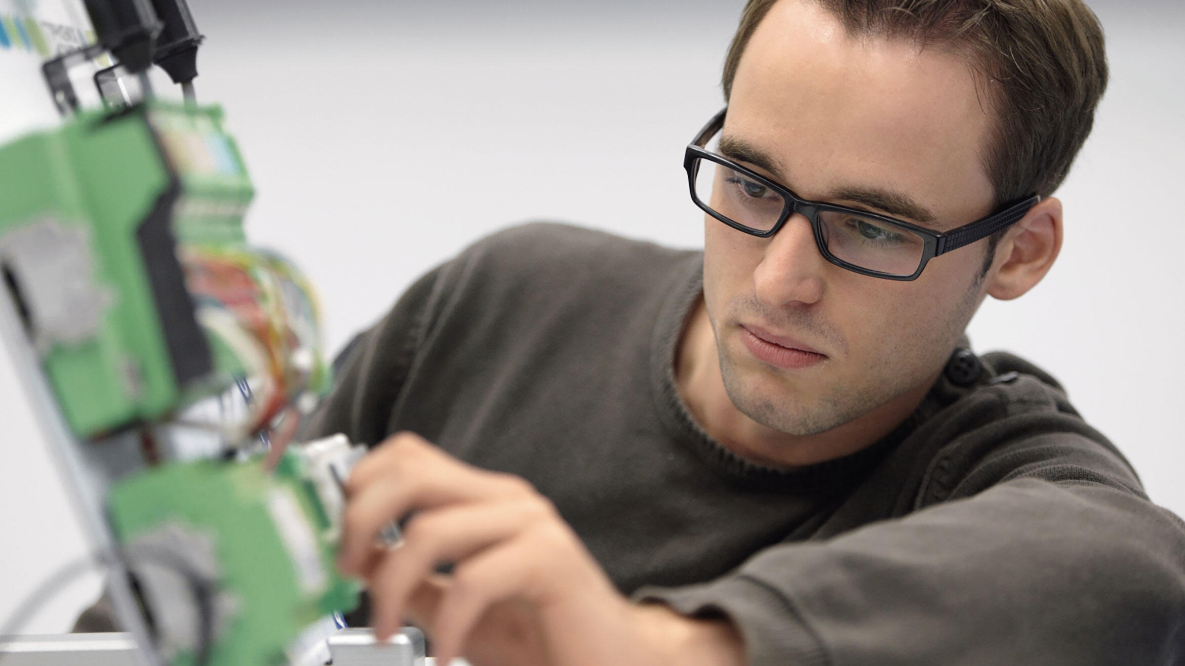 man working on  electronical equipment