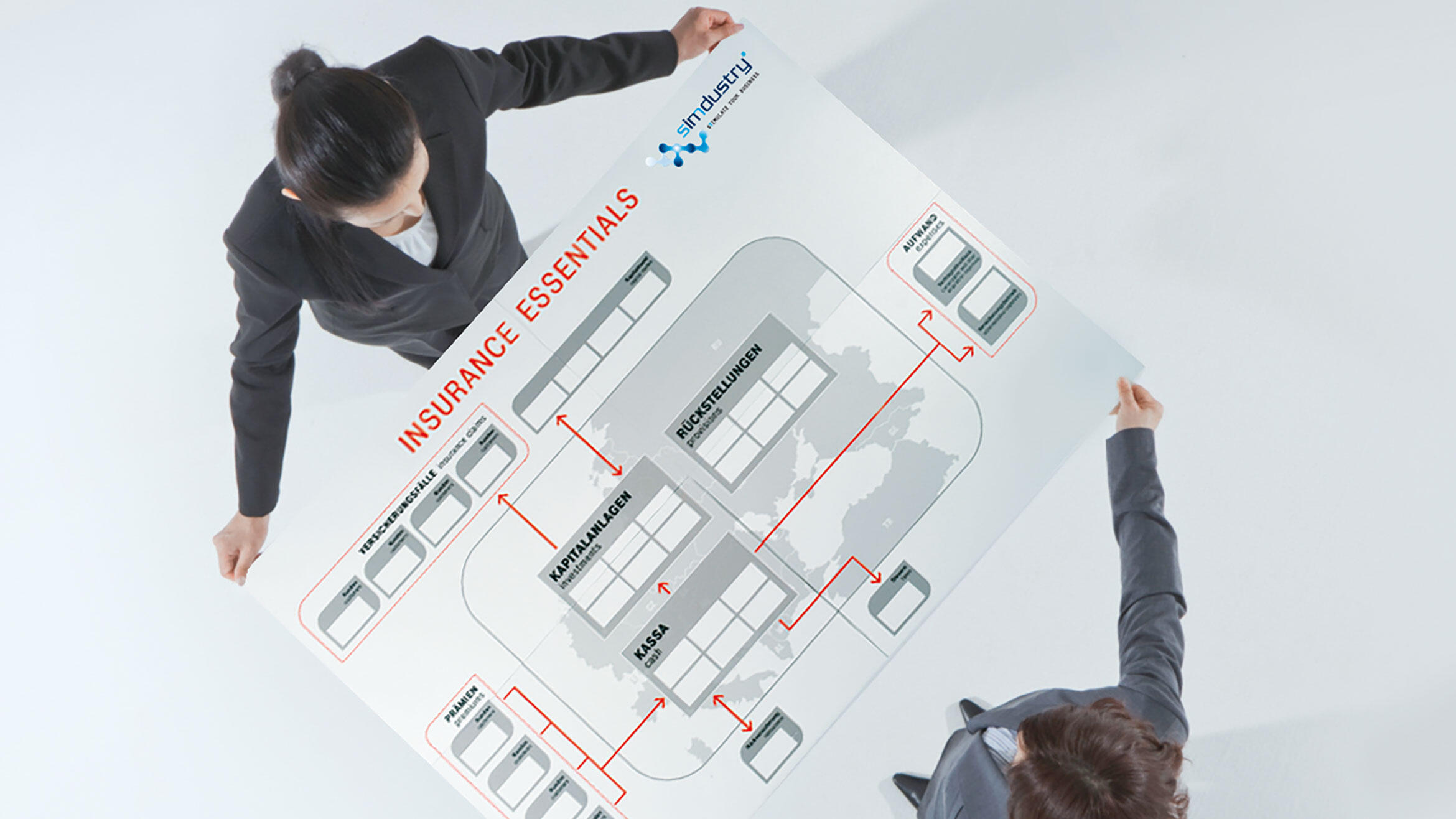  top view on two women holding a large printed graph