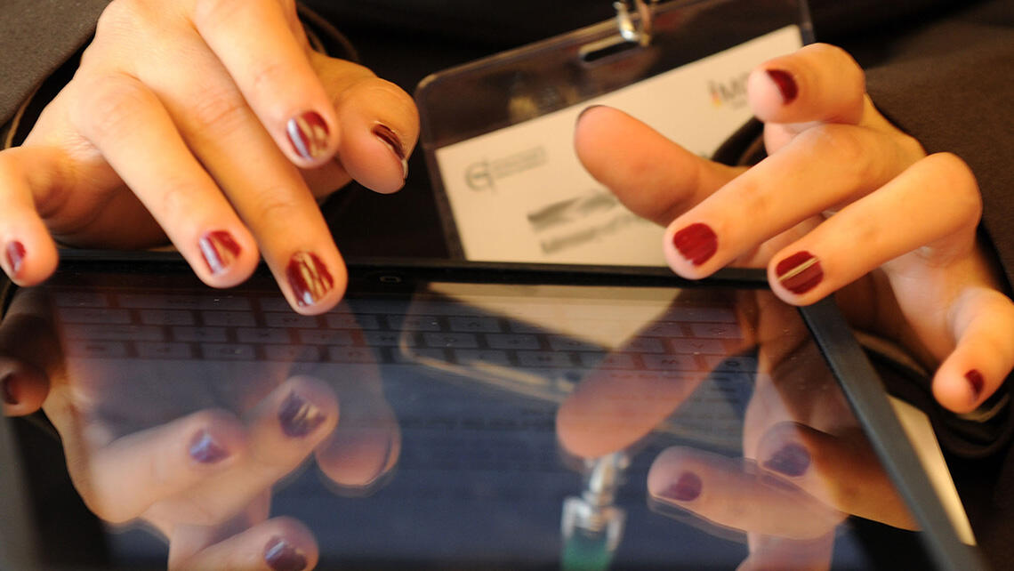 close-up: hand over the display of a portable terminal