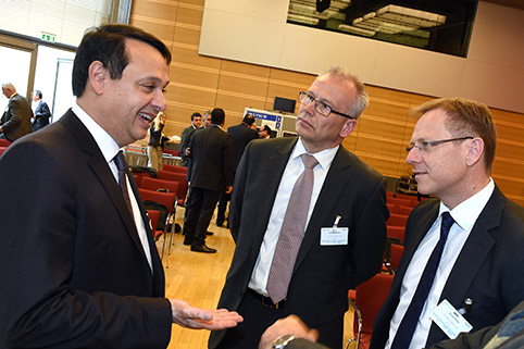 conversation amongst three participants during a break