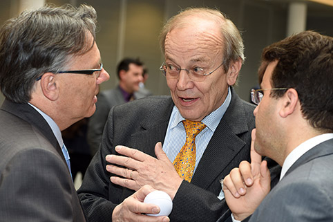 close-up of a conversation amongst three participants during a break
