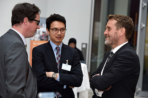 conversation amongst three participants during a break