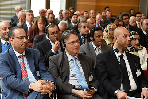 view of the fully occupied rows of chairs in the conference room
