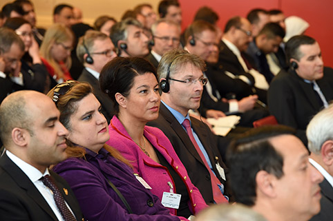 view of the fully occupied rows of chairs in the conference room