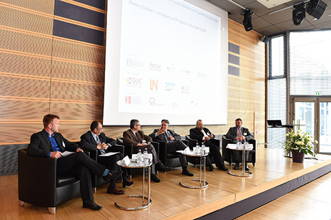 speakers of the plenary session on the podium