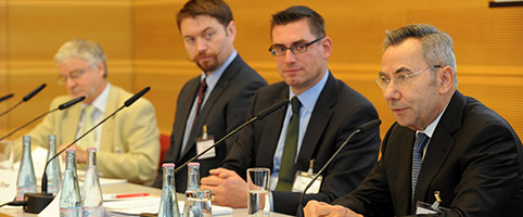 participants and chair of the session on the podium