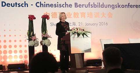 Woman speaks from the podium