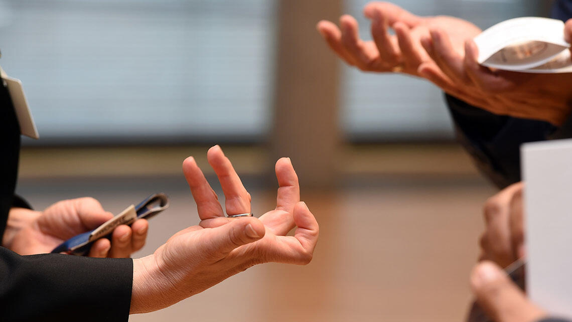 detailed view: gesturing hands