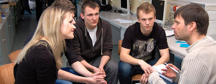 small group of trainees listening to their trainer