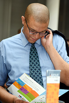 person leafing through a brochure