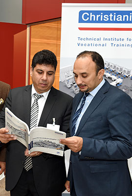 two person leafing through a brochure