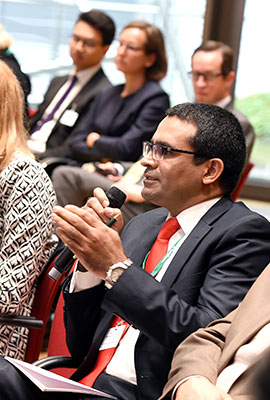 Close-up of a listener speaking in a microphone