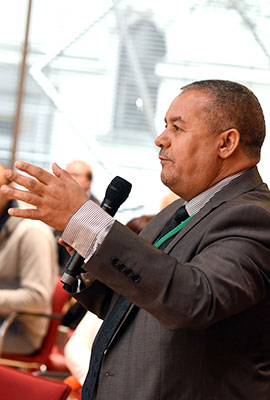 Listener standing with a microphone in his hand
