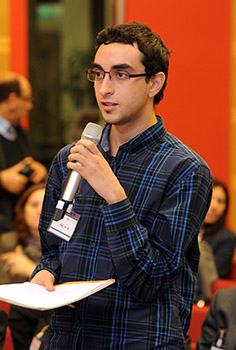 participant asks a question to the speakers